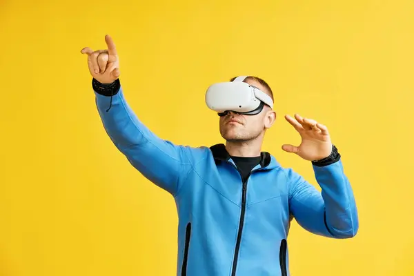 Man Wearing Virtual Reality Goggles Yellow Background Future Concept Stock Picture