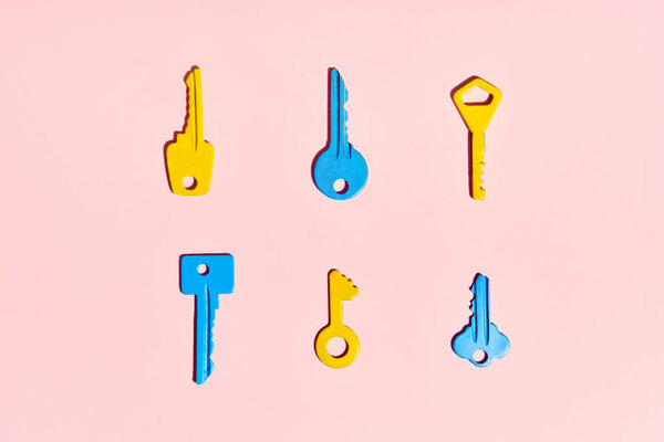 Various Colorful Keys Pink Background Flat Lay Stock Image