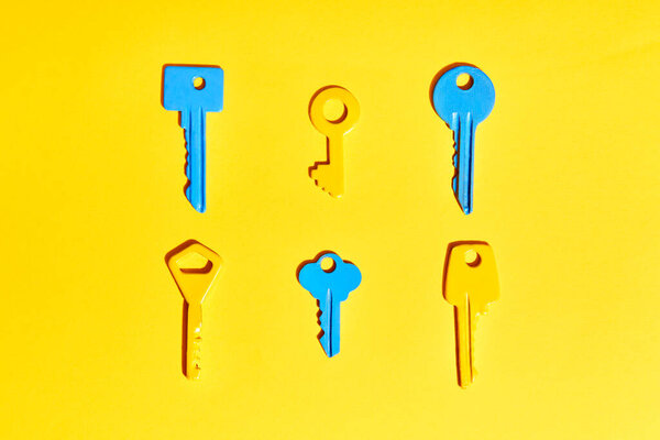 Various Colorful Keys Vibrant Yellow Background Flat Lay Royalty Free Stock Photos