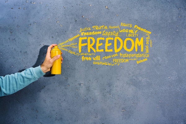 Graffiti Painter Spray Paint His Hands Draws Word Freedom Synonyms Stock Image