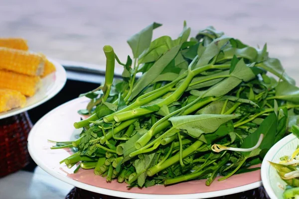 Water spinach on a round plate