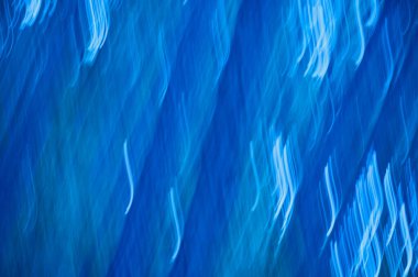 abstract blue background with some smooth lines in it and some motion blur