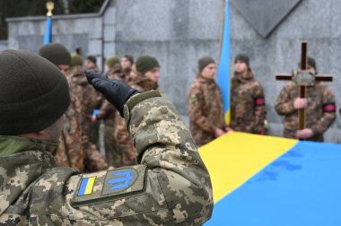 Lviv, Ukraine - January 18, 2023: A funerals of Ukrainian servicemen killed during combat with Russian troops.  clipart