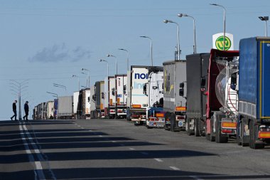 Lviv region, Ukraine - November 9, 2023: A trucks stay at long line near the Rava-Ruska border checkpoint on the Ukrainian-Polish border. clipart