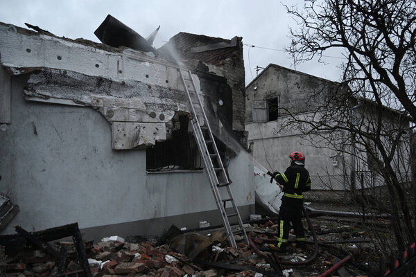 Lviv, Ukraine - January 1, 2024: Ukrainian firefighters inspect the destroyed building Roman Shukhevych Museum after a Russian drone attack in Lviv. 