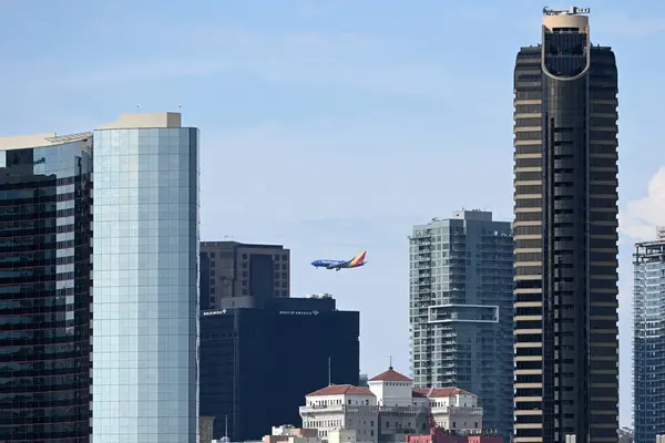 stock image San Diego, CA, USA - July 31, 2023: The Southwest Airlines plane flies by Downtown San Diego.