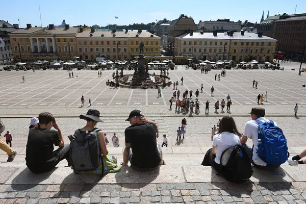 stock image Helsinki, Finland - July 25, 2024: A people on the  Senate Square (Senaatintori) in Helsinki.