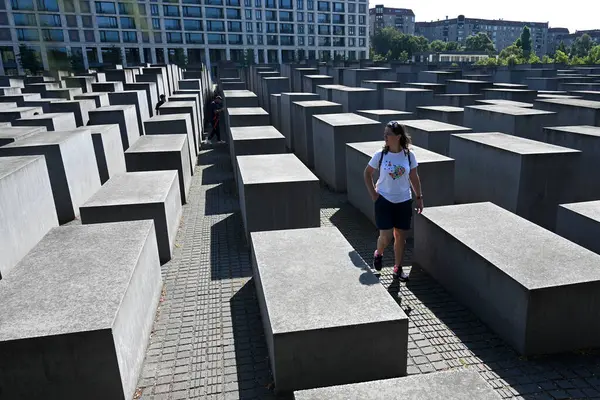 stock image Berlin, Germany - August 3, 2024:  People on the Memorial to the Murdered Jews of Europe.