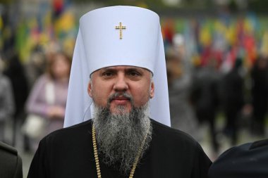 Lviv, Ukraine - October 1, 2024: The Metropolitan Epiphanius of Kyiv and All Ukraine at Lychakiv cemetery to mark Defenders Day of Ukraine in Lviv. clipart