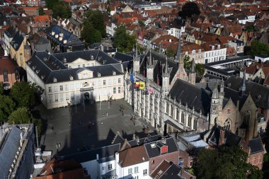 Bruges, Belgium - August 28, 2024: Bruges City Hall (Stadhuis Brugge)  top view from the Belfort (belfry) tower in old town. clipart