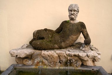 The old sculpture of Babuino fountain (Fontana del Babuino) is situated in via del Babuino in Rome, Italy. The Baboon is one of the talking statues of Rome. clipart