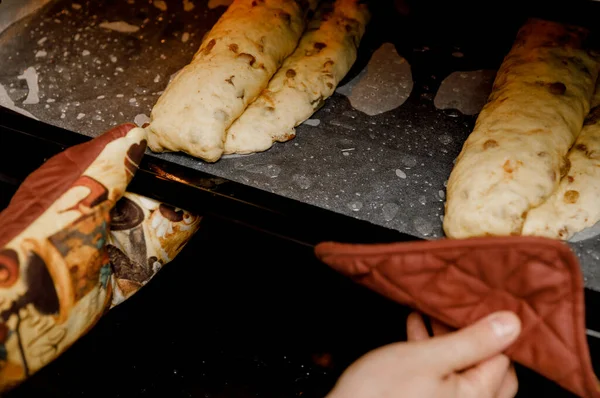 Woman Puts Baking Sheet Traditional German Christmas Bread Stollen Oven — Stock Photo, Image