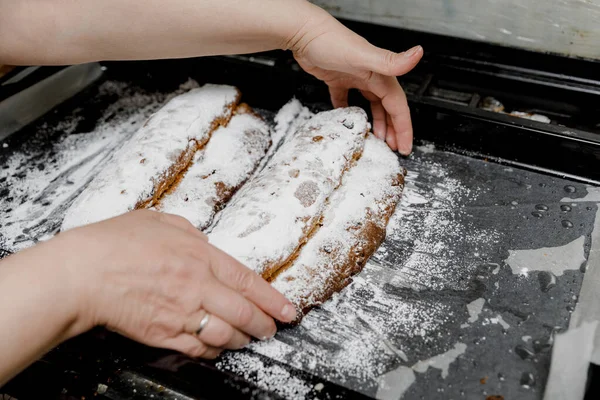 German Traditional Stollen Breads Sprinkled Powdered Sugar Baking Sheet Female — Stock Photo, Image
