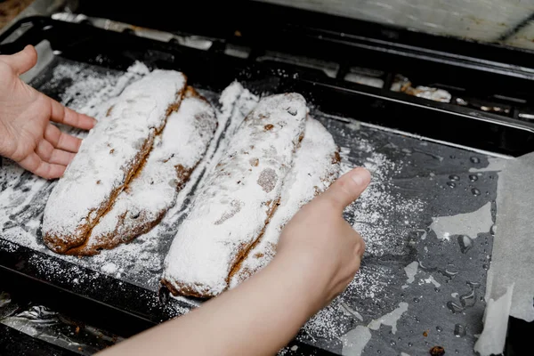 German Traditional Stollen Breads Sprinkled Powdered Sugar Baking Sheet Female — Stock Photo, Image