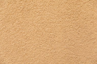 Soluk sarı kumlu arka plan. Kumlu doku.