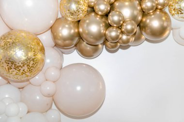 White and gold balloons with confetti on a white background are creating an elegant and festive atmosphere. Background. Festive background. clipart