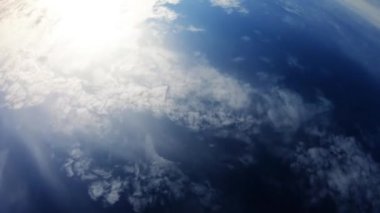 Cloudy Day With Blue Sky And Sun Showing Trough Clouds