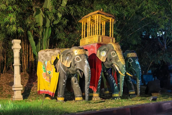 Three traditional elephants statues in the park in front of Mysore palace in Mysore city, Karnataka, India.