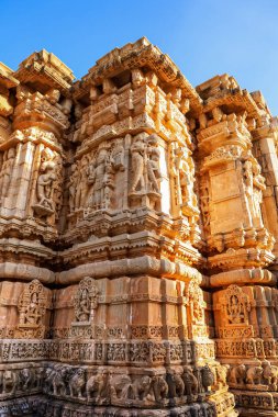 Intricate architecture and ruins on Goddess Shani Deity Temple in the Chittorgarh fort in Rajasthan, India. clipart