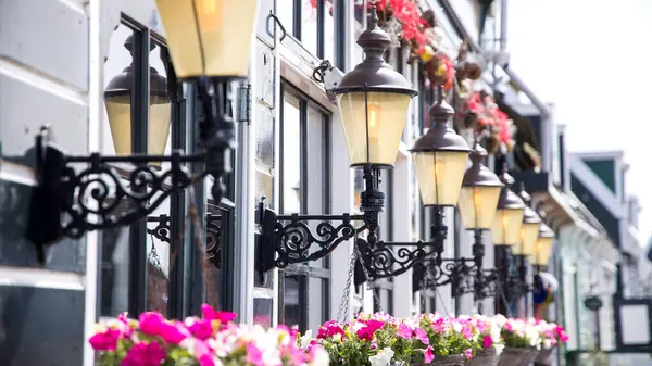 stock image Close up view of row of lamps on exterior wall, in Marken island, Netherlands.