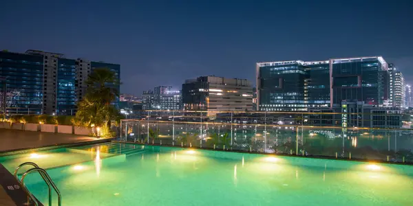 stock image Hyderabad, INDIA - December 08, 2023 : Information technology buildings and swimming pool in Hyderabad city, otherwise called the HITEC City, is the second biggest IT exporter in India.