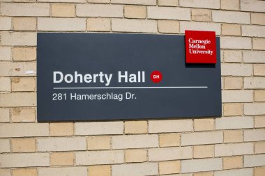 Pittsburgh, Pennsylvania, USA - August 12, 2024: Doherty Hall sign on Carnegie Mellon's Pittsburgh campus, a state of the art chemical engineering laboratory facility. clipart