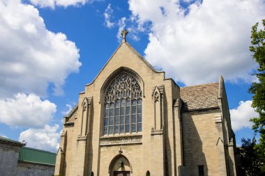 First Christian Church in Youngs town state University in Ohio against blue sky. clipart