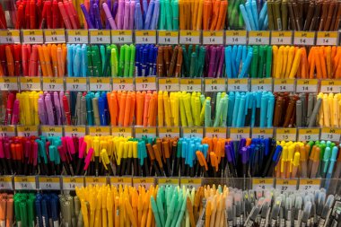 Bangkok, Thailand- December 12,2023 : Colorful pens and markers are up for sale in Iconsiam mall Loft store , Bangkok, Thailand. clipart