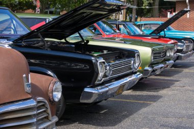 BIRMINGHAM, MI, USA - AUGUST 17, 2024, Cruisers show at Woodward dream cruise, is the worlds largest one-day automotive event, drawing 1.5 million people each year from around the globe. clipart