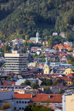 Aerial view of colorful historic buildings in Innsbruck, Austria during autumn time.