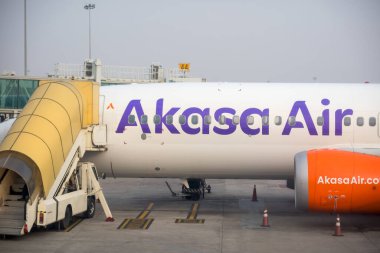 Hyderabad, INDIA - December 10, 2023 :Akasa Air flight at Hyderabad International airport is an Indian low-cost airline headquartered in Mumbai, Maharashtra, India. clipart