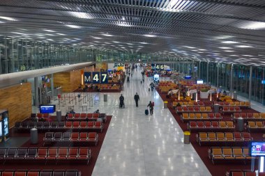 CDG Airport , Paris, France -December 05, 2023 : Departure gates at Charles de Gaulle Airport in Paris, France. clipart