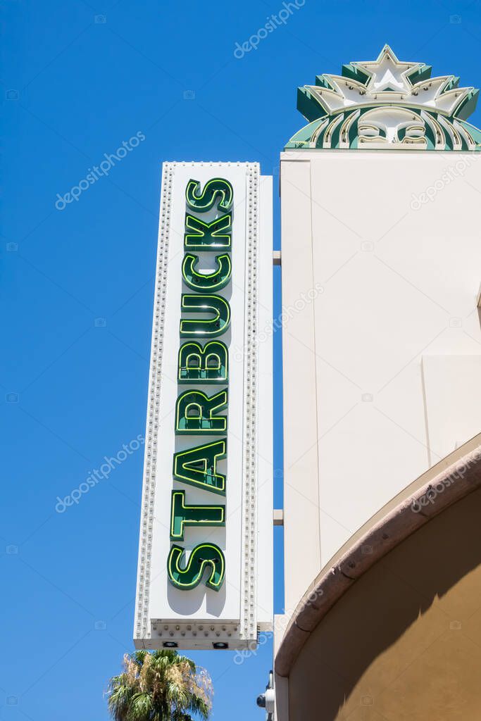 LAS VEGAS, NV, USA - 05, JULY, 2024: Signage of Starbucks , largest coffeehouse chain in the world, Las Vegas strip, Nevada against blue sky
