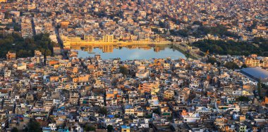 Jaipur, Rajasthan, India - October 11, 2022: Panoramic view of Jaipur cityscape, Many structures built around Tal Katora Lake in Jaipur city, Rajasthan, India.