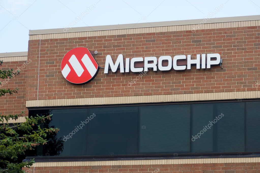 Farmington Hills, Michigan - August 13, 2024: Microchip Technology signage is an American manufacturer of microcontroller, memory and analog semiconductors