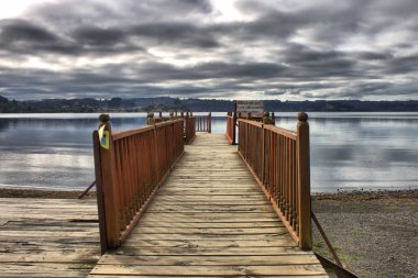 Wooden pier at Llanquihue lake in Puerto Octay, Chile clipart
