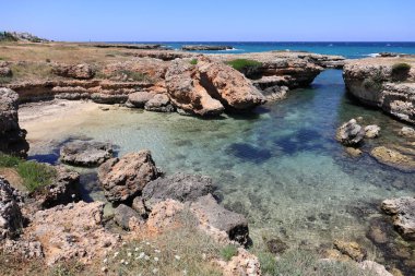 Picturesque seascape with cliffs in Ostuni, Salento coast. Puglia, Italy clipart