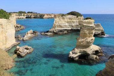 Picturesque seascape with cliffs in Torre Sant Andrea, Salento coast. Puglia, Italy clipart