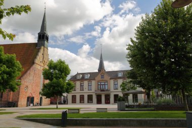 The Square Markt located in the historical center of Dokkum, Friesland, Netherlands, with Martinus Church (Grote Sint Martinuskerk) clipart