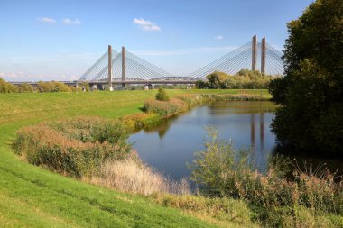 View from the Stadsdijk (City dike) towards the Martinus Nijhoff Bridge, a trafic bridge over the river Waal in Zaltbommel, Gelderland, Netherlands