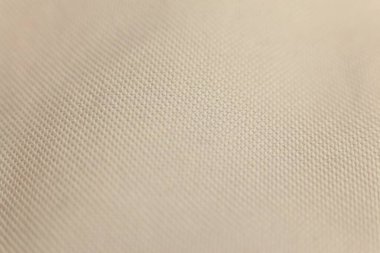 Bej kumaş arkaplanı kapat. Yumuşak odak ve sığ DOF.