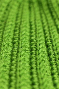 Arka plan olarak yeşil örülmüş kumaş. Resmi kapat..