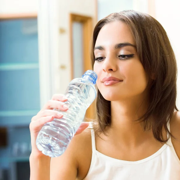 Young Woman Drinking Water Indoors — Stock Photo, Image