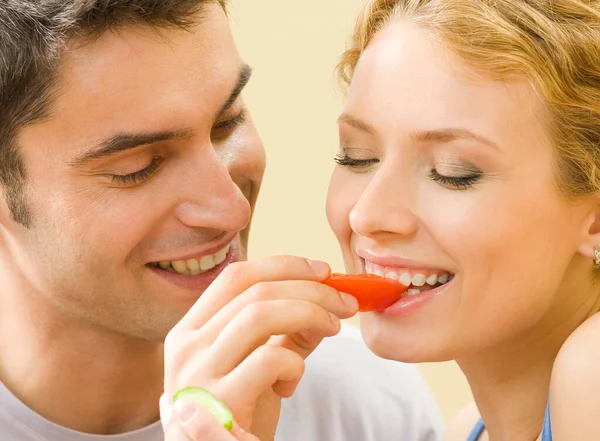 Cheerful Young Couple Eating Together Tomatoes — Stock Photo, Image