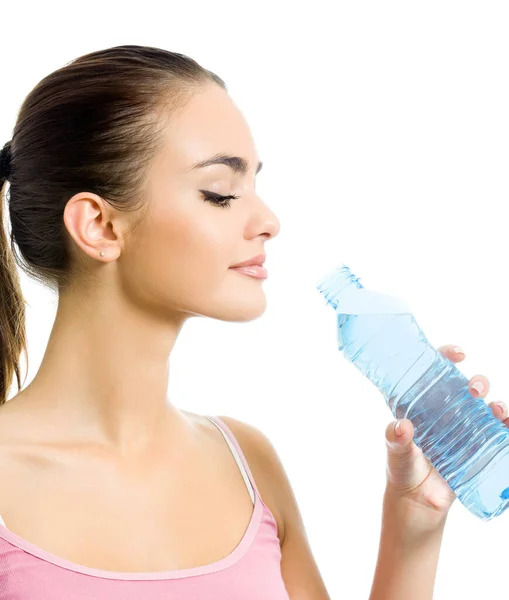 年轻快乐的微笑女人在运动服的饮用水 孤立在白色背景 — 图库照片