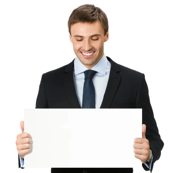 幸せな笑顔若いビジネス男白い背景で隔離された空白の看板を示す — ストック写真