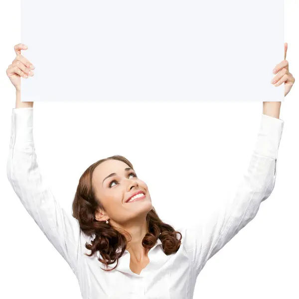 幸せな笑顔若いビジネス女白い背景で隔離された空白の看板を示す ストックフォト