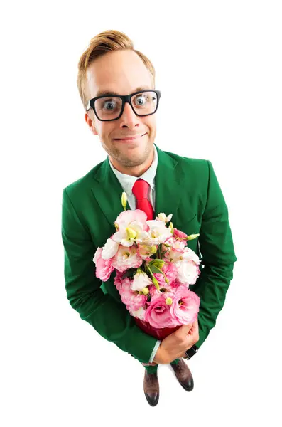 メガネの面白い若いビジネスマンの完全なボディ肖像画 緑の自信を持ったスーツと赤いネクタイ 花束を保持しています トップアングルビューショット 白い背景の上に隔離 ビジネスコンセプト ロイヤリティフリーのストック画像