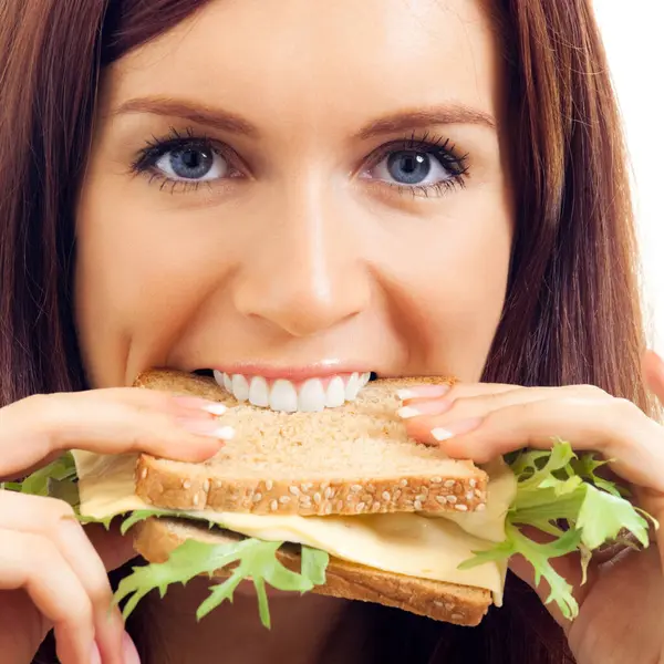 Jovem Feliz Comendo Sanduíche Com Queijo Isolado Contra Fundo Branco — Fotografia de Stock
