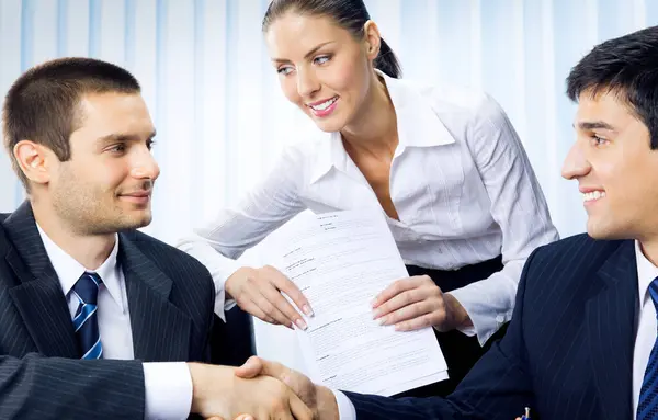 Three Businesspeople Handshaking Document Office — Stock Photo, Image